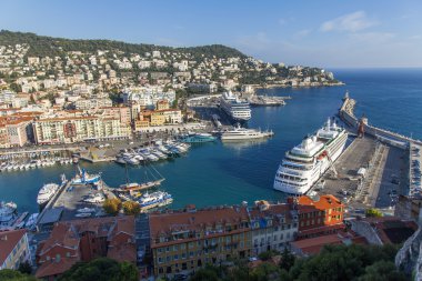 France , Cote d'Azur . Nice, October 16, 2013 . View of the ships and yachts in the port of Nice hill Chateau. clipart