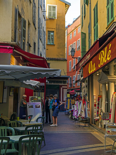 France , Cote d'Azur . Nice, narrow street of the old town , and you men late in the season