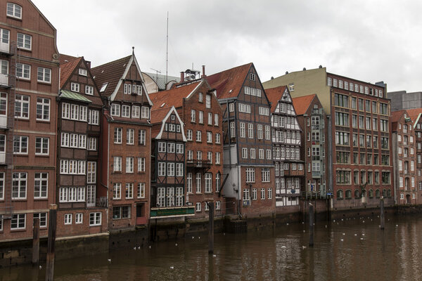 Hamburg, Germany , February 19, 2013. View of the old houses on the banks of the Alster river channels on a cloudy winter day.