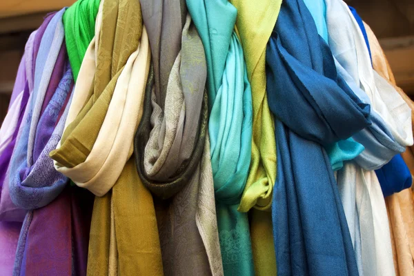 Colorful scarves on display in store — Stock Photo, Image