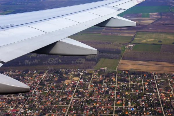 View from the window of the flying plane on the earth and clouds