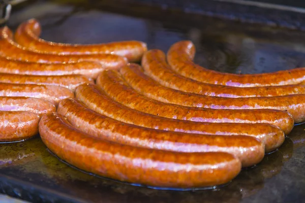 Budapest, Hungary, Fair. Hungarian sausages fried in a pan in the outdoor cafes — Stock Photo, Image