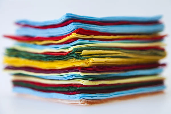 Pile of multi-colored paper napkins — Stock Photo, Image