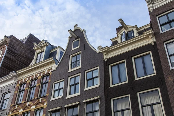 Amsterdam, the Netherlands, Typical architectural details of facades of the town houses constructed of the burned brick — Stock Photo, Image