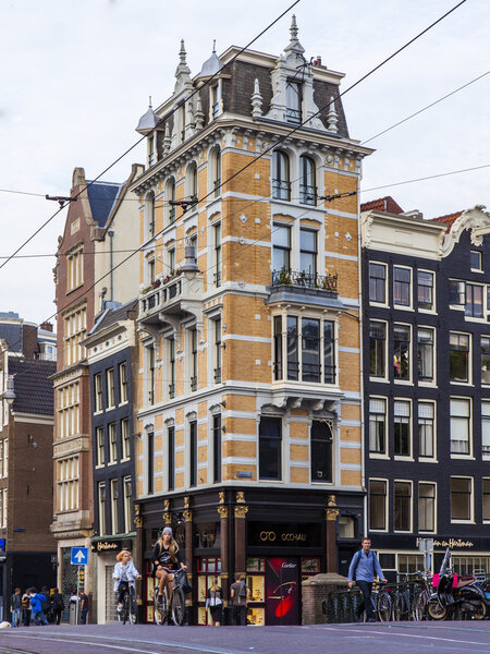 Amsterdam, Netherlands, on July 7, 2014. Tourists and citizens go down the street