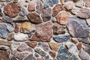 Eski bir taş gözenekli duvarın yüzeyi
