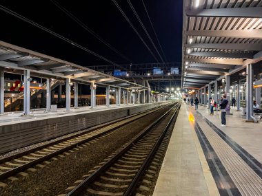 Sochi, Russia, October 20, 2021.  Adler station. Platform for regional express Lastochka at evening time