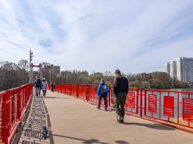 Pushkino, Russia, April 26 2021. pedestrian bridge via river Serebryanka 