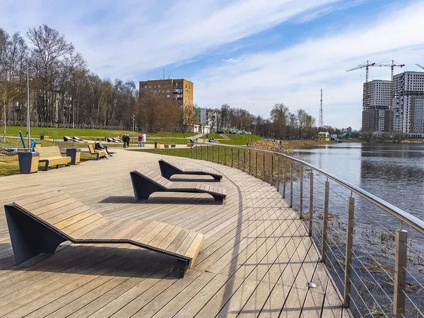 Pushkino, Russia, April 26, 2021. Recreation area on the picturesque bank of the Serebryanka river.
