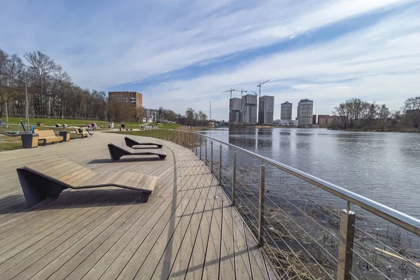 Pushkino, Russia, April 26, 2021. Recreation area on the picturesque bank of the Serebryanka river.