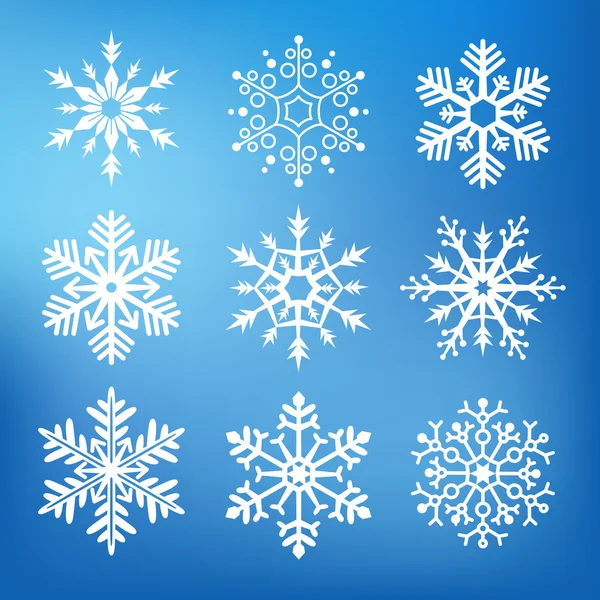 Nueve lindos copos de nieve — Vector de stock