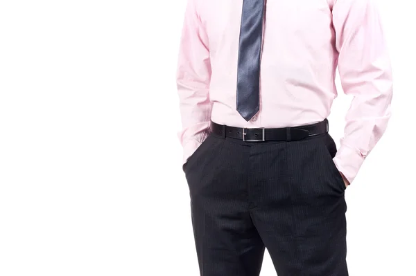 Bem vestido homem de pé com as mãos nos bolsos isolados no fundo branco Fotografia De Stock