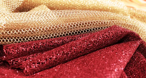 Золотая и красная ткань — стоковое фото