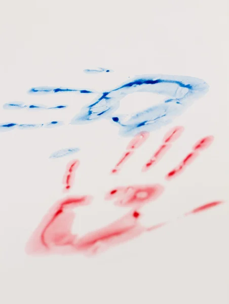 Синьо-червоний відбиток руки — стокове фото