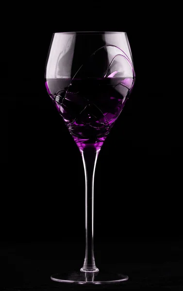 Wine glass with magenta potion — Stock Photo, Image