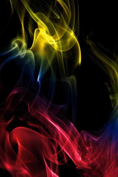 Multicolored smoke in black background