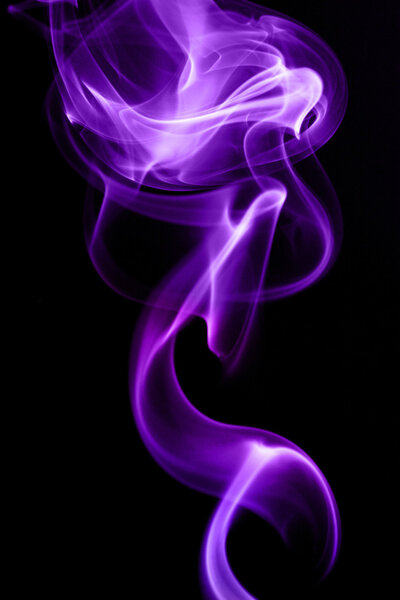 Purple smoke in black background