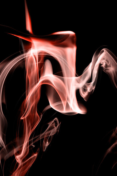 Red smoke on natural black background