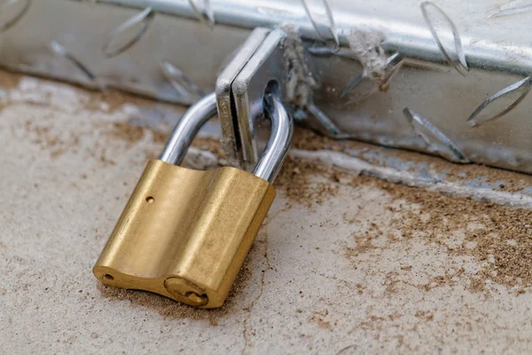 A padlock on an iron door — Stock Photo, Image