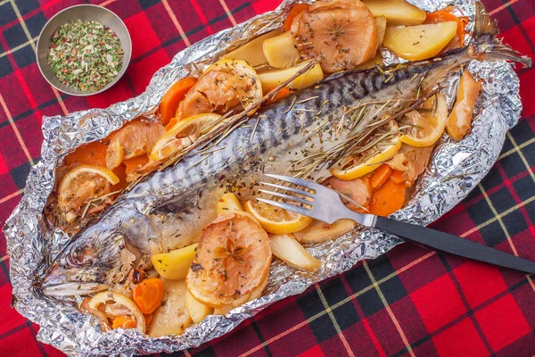 baked fish on a tablecloth — 图库照片 #25912841