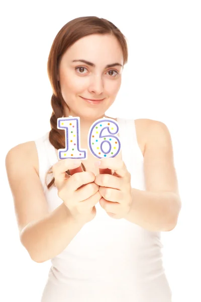 Beautiful woman with two candles (focus on candles) — Stock Photo, Image