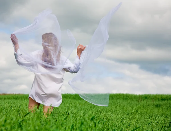 Woman with fluttering scarf — Stock Photo, Image