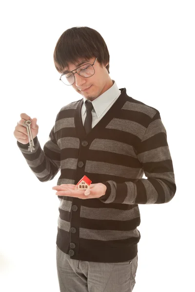 Businessman with toy house and keys in his hands — Stock Photo, Image