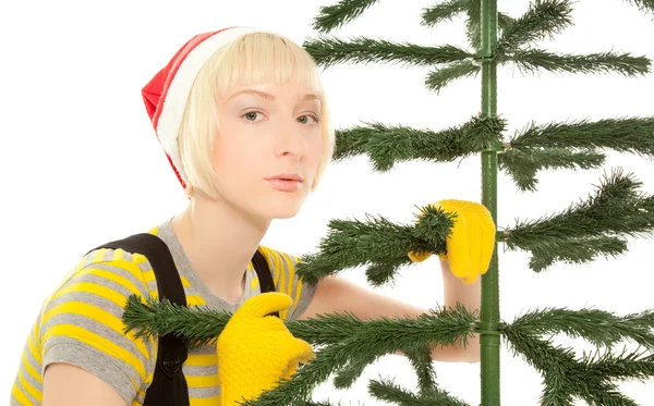 Woman in yellow gloves with fir — Stock Photo, Image