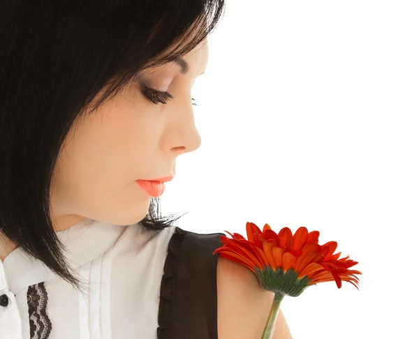 Woman looking on the red flower — Stock Photo, Image