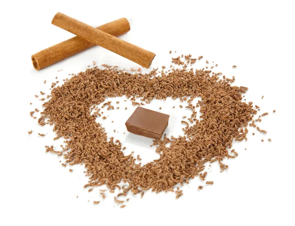 A plate with grated chocolate and cinnamon — Stock Photo, Image