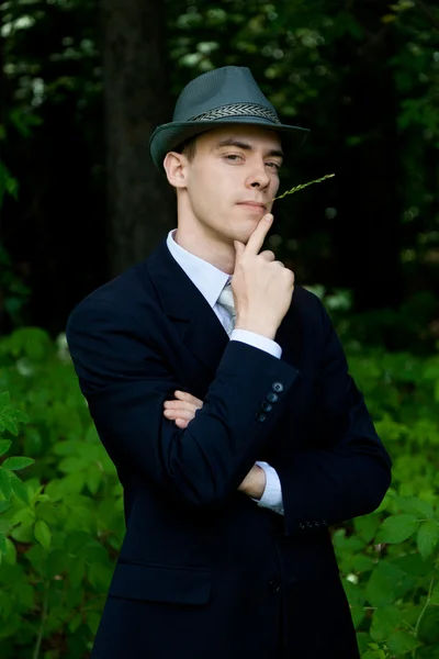 Man in black suit outdoors — Stock Photo, Image