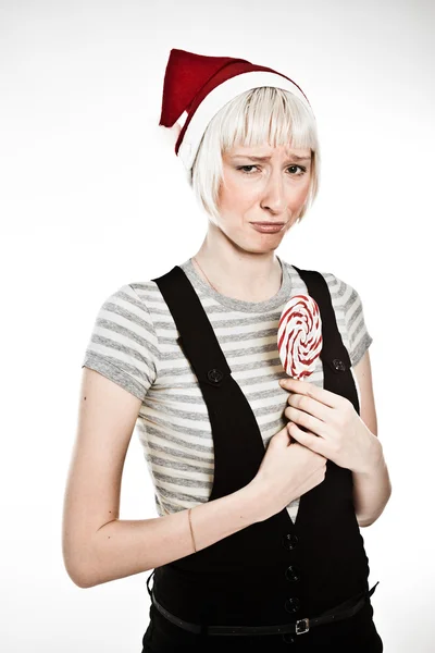 Upset woman with lollipop — Stock Photo, Image