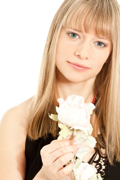 Portrait of beautiful young woman holding a flower — Stock Photo, Image