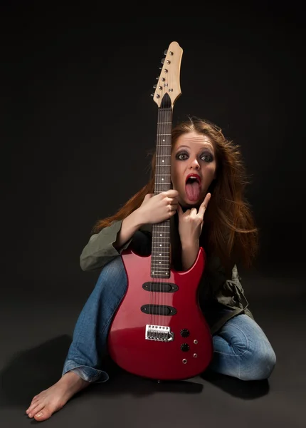 Mulher com uma guitarra — Fotografia de Stock