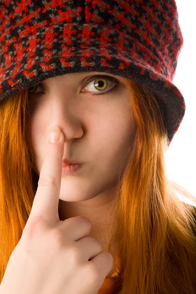 Red haired girl touching her nose — Stock Photo, Image