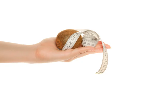 Woman's hand with kiwi and tape measure isolated on white — Stock Photo, Image