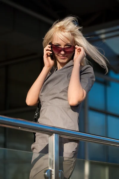 Beautiful woman calling to cellphone — Stock Photo, Image