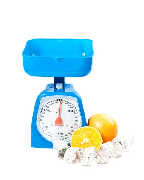 Picture of scales, oranges and measure tape on the white — Stock Photo, Image