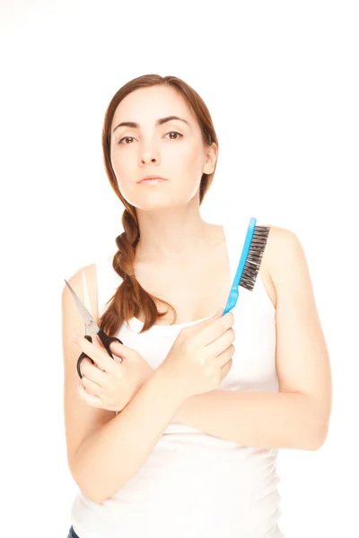 Hairdresser holding a scissors and comb — Stock Photo, Image