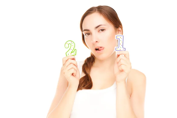 Beautiful woman with two candles on the white background — Stock Photo, Image