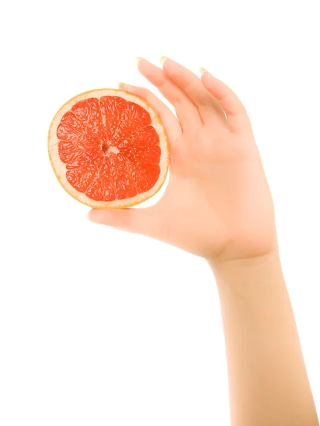 Manos de mujer con trozos de pomelo aislados — Foto de Stock