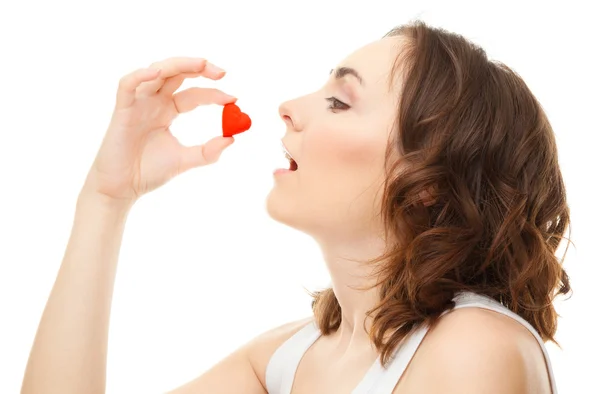 Young woman holding a heart — Stock Photo, Image