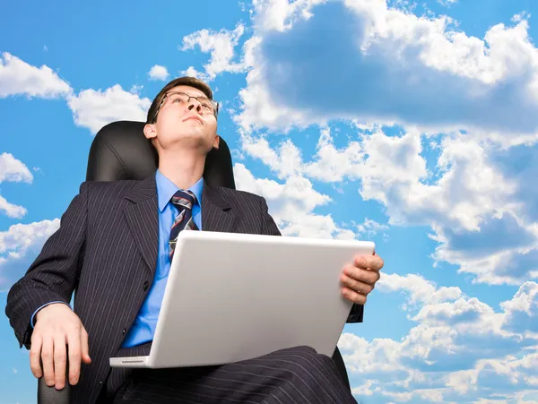 Office worker at sky background — Stock Photo, Image