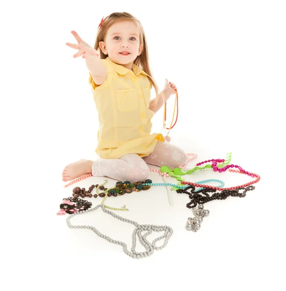 Little girl with a lot of jewel laughing — Stock Photo, Image