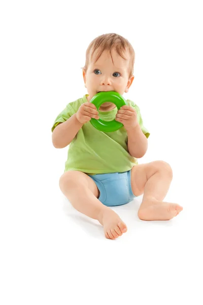 Adorable baby biting a toy isolated on white — Stock Photo, Image