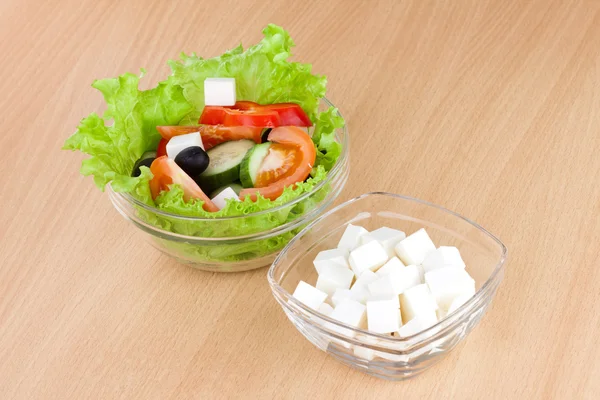 Picture of plates with greek salad and feta — Stock Photo, Image
