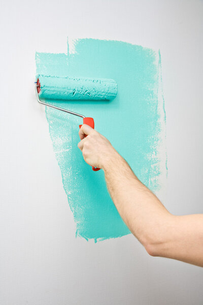 Painting the wall with roller