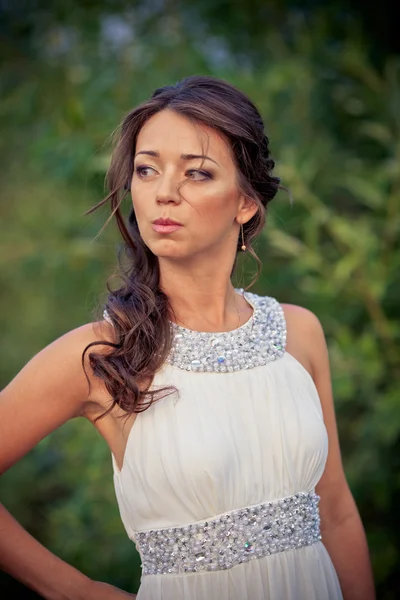 Young woman in white dress on nature — Stock Photo, Image