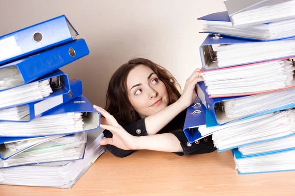 Beautiful businesswoman with a lot of folders — Stock Photo, Image