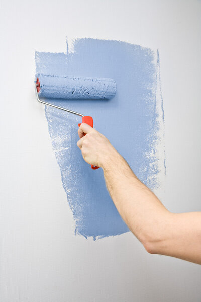 Painting the wall with roller